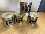 Wisconsin 4-CYLINDER Replacement Pistons #566 .003 O/s Nos. Fixed Price $50.00.